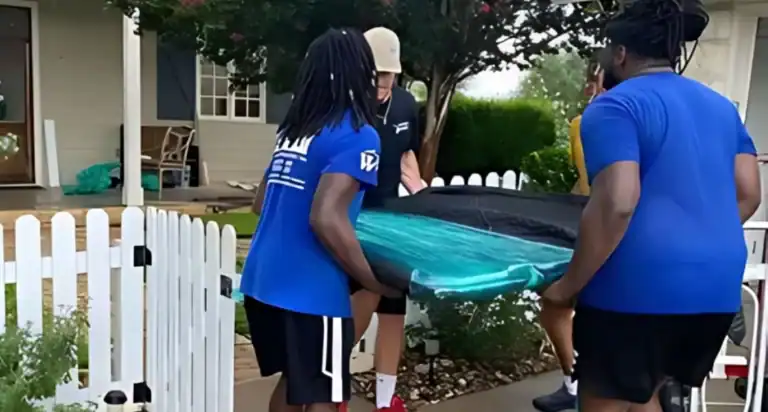 Apartment movers carrying boxes up the stairs